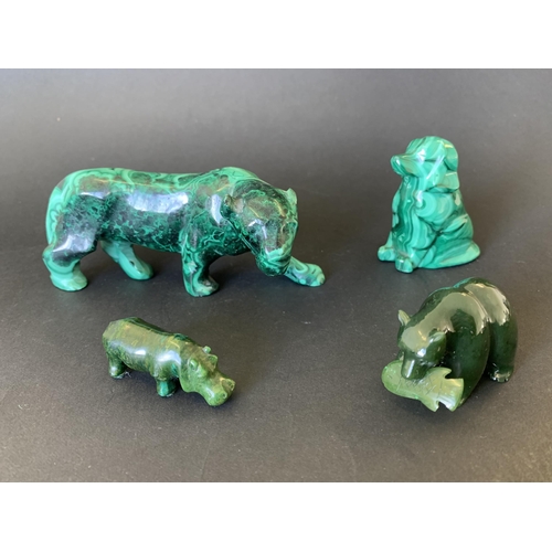 193 - A polished malachite tiger (as found ear), a small dog plus two dark green stone animals, a bear wit... 