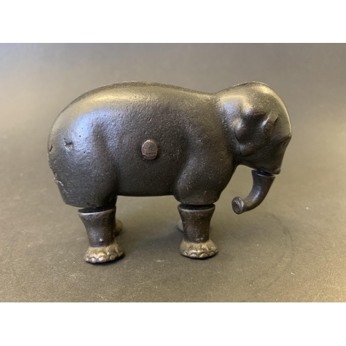 219 - A late 19th Century cast iron walking elephant toy, marked 'Patent 1873', most likely made by the Iv... 