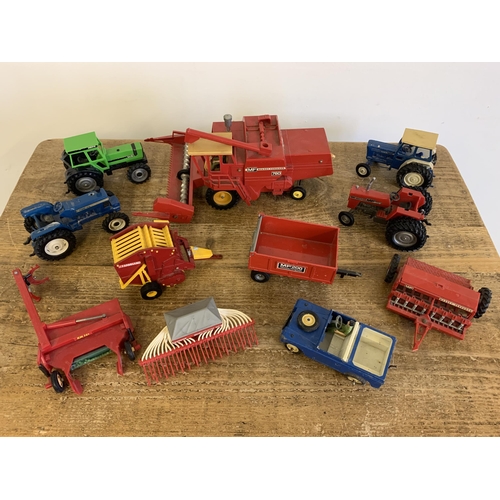 227 - Four vintage Britains tractors, farm accessories and a jeep (all with playwear)