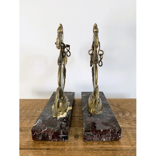 25 - A pair of vintage solid brass Venetian gondola seahorses mounted on marble style bases, 10 3/4