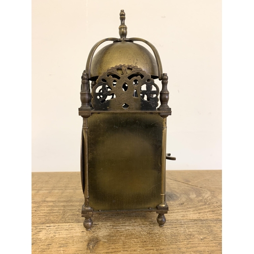 260 - An antique brass lantern clock with a French 8 day striking movement, marked J P on back plate for J... 