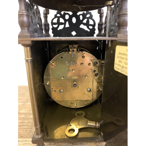 260 - An antique brass lantern clock with a French 8 day striking movement, marked J P on back plate for J... 