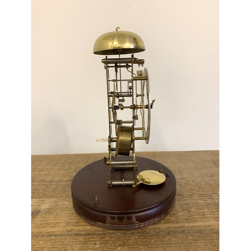 261 - A vintage West German 'Hermle' brass striking skeleton clock under glass dome, approx. 11 1/2