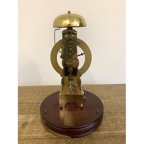 261 - A vintage West German 'Hermle' brass striking skeleton clock under glass dome, approx. 11 1/2