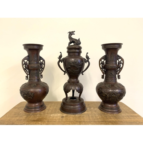 264 - A vintage garniture of bronze vases, possibly Japanese, the pair decorated with birds and flowers, t... 