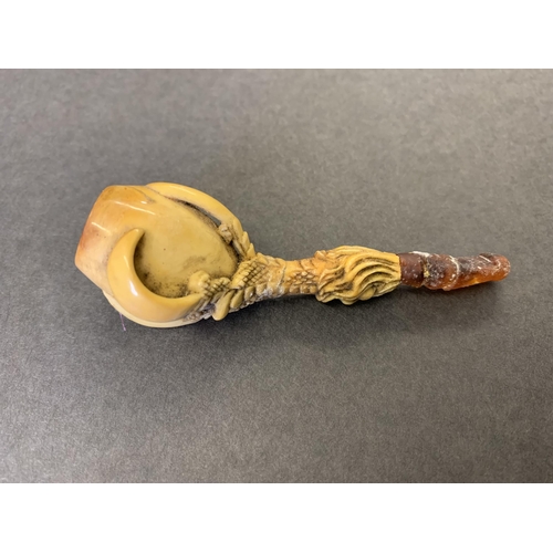 271 - A cased antique Meerschaum pipe with amber style mouthpiece with a bird claw clutching the bowl, app... 