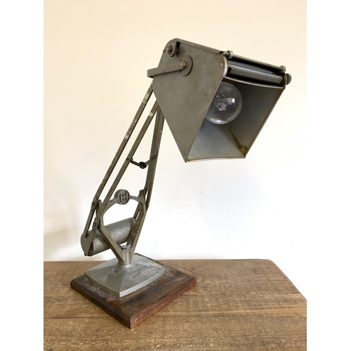 277 - A vintage Horstmann 'Pluslite' Anglepoise lamp with flip out magnifying glass, approx. 19