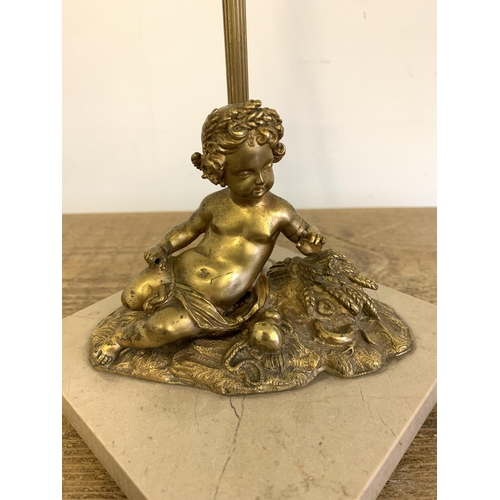 278 - A vintage gilded metal cherub lamp base with cut glass lustres and marble style base, approx. 17