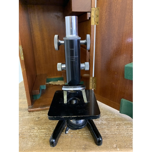 282 - A cased vintage black finish microscope by W Watsons & Sons Ltd London, marked 'Kima', 'Bot. Dept Gl... 