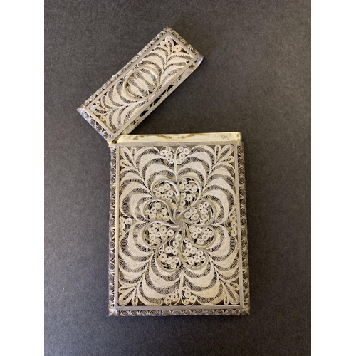 285 - An antique white metal intricate filigree work card case in original box, named Bull Black & Co Broa... 