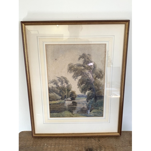 312 - Joseph Walter West (1860-1933), a framed and glazed watercolour of a boat on a river, signed lower r... 