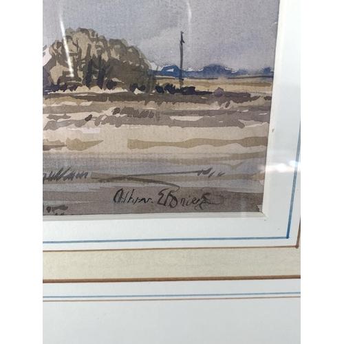 319 - A framed and glazed watercolour of a windmill in a landscape, the signature lower right is most like... 