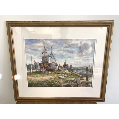 326 - John Patchett, Beccles artist (b1946), a framed and glazed pastel picture of fishing boats in dry do... 