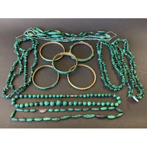 336 - A large collection of malachite jewellery including bangles (brass rings), necklaces and bagged loos... 