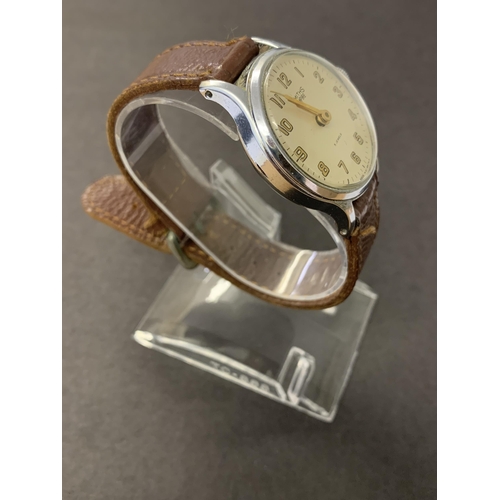 342 - A vintage Smiths Empire wristwatch on brown leather strap, 32mm dia (ticks and runs, minor scratches... 