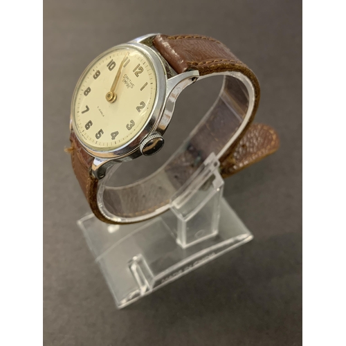 342 - A vintage Smiths Empire wristwatch on brown leather strap, 32mm dia (ticks and runs, minor scratches... 