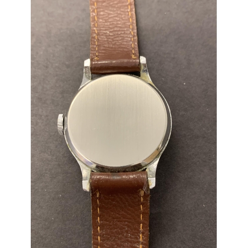 342 - A vintage Smiths Empire wristwatch on brown leather strap, 32mm dia (ticks and runs, minor scratches... 