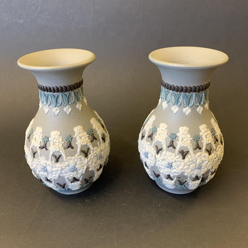 35 - A pair of Victorian Doulton Lambeth Silicon ware small vases, dated 1883 to base, approx. 4 3/4