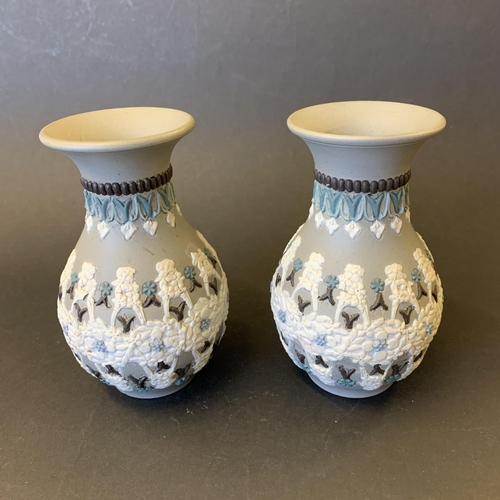 35 - A pair of Victorian Doulton Lambeth Silicon ware small vases, dated 1883 to base, approx. 4 3/4