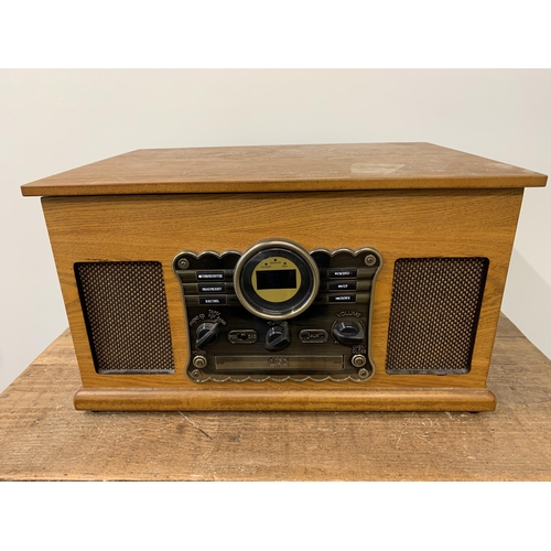 359 - A vintage style music system including radio, CD player, record deck and tape cassette player