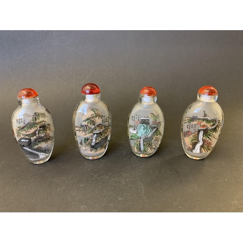 380 - Four Chinese internal painted snuff bottles, each 3