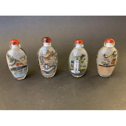 380 - Four Chinese internal painted snuff bottles, each 3