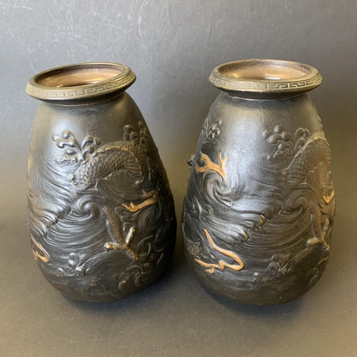 41 - A pair of vintage Bretby vases decorated with dragons and gilded highlights, approx. 8