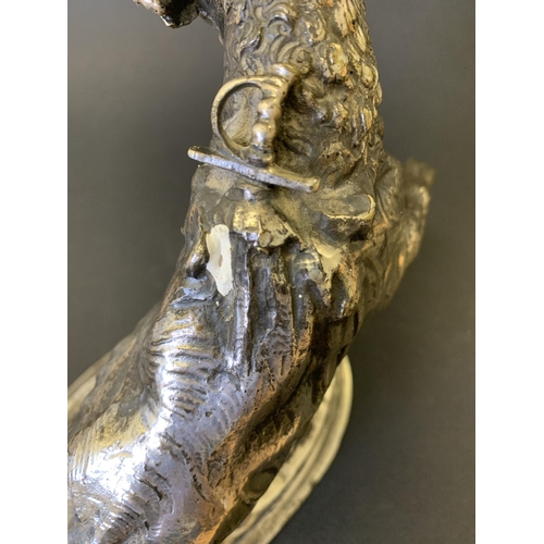 48 - A cast metal bull figurine with a white metal finish, in rearing pose with a sword in his back (and ... 