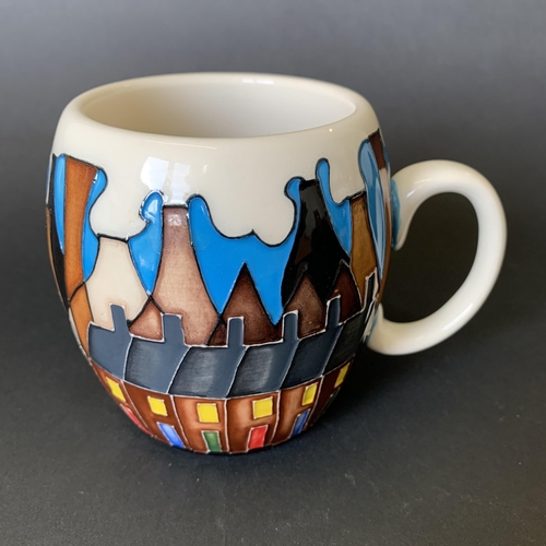 5 - A Moorcroft mug in the 'Chimneys' pattern, dated 2014 to base, approx. 3 1/2