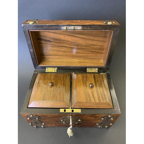 59 - An antique burr wood veneer double tea caddy, brass banded with central white metal figural scene pl... 