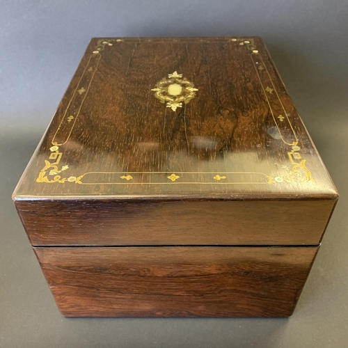 61 - A Victorian ladies travelling vanity/dressing box, inlaid with mother of pearl and over gilding, the... 