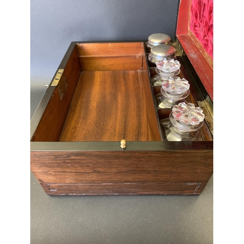 61 - A Victorian ladies travelling vanity/dressing box, inlaid with mother of pearl and over gilding, the... 