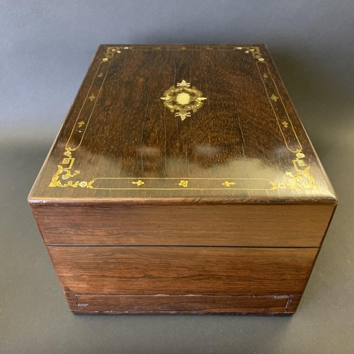 61 - A Victorian ladies travelling vanity/dressing box, inlaid with mother of pearl and over gilding, the... 