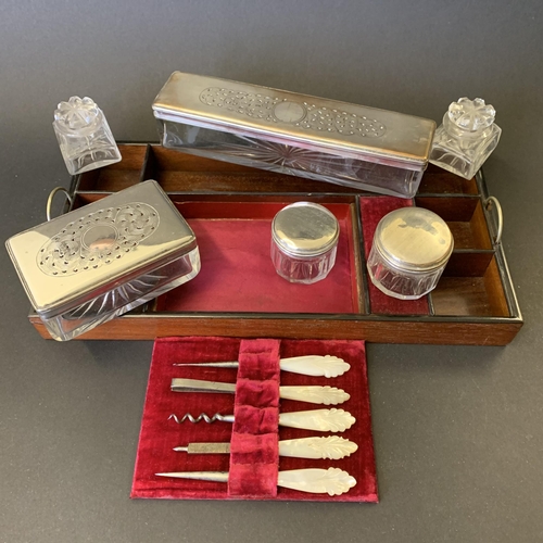 61 - A Victorian ladies travelling vanity/dressing box, inlaid with mother of pearl and over gilding, the... 