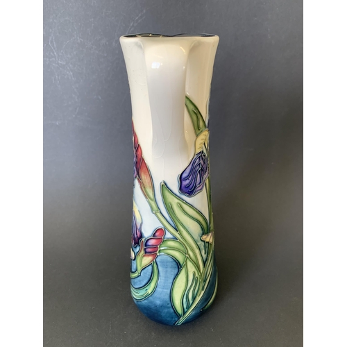 67 - A Moorcroft jug in the 'Iris' pattern, marked M.C.C. 1089 (Moorcroft Collectors Club), approx. 9 1/4... 