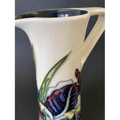 67 - A Moorcroft jug in the 'Iris' pattern, marked M.C.C. 1089 (Moorcroft Collectors Club), approx. 9 1/4... 