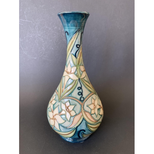 68 - A Moorcroft vase in the 'Jasmin Carousel' pattern, marked with a silver line to the base for a 'seco... 