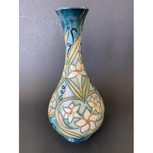 68 - A Moorcroft vase in the 'Jasmin Carousel' pattern, marked with a silver line to the base for a 'seco... 