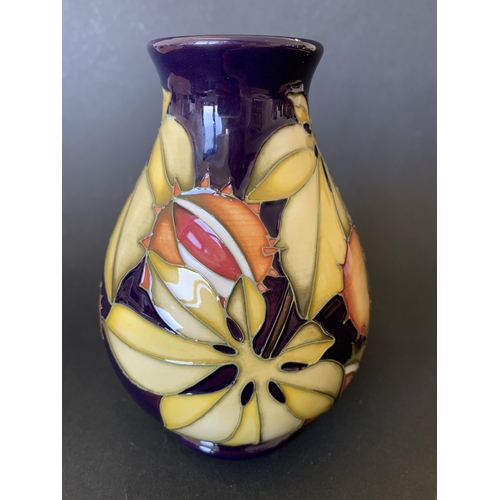 69 - A Moorcroft limited edition vase in an unusual pattern decorated with chestnuts and leaves, possibly... 