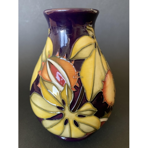 69 - A Moorcroft limited edition vase in an unusual pattern decorated with chestnuts and leaves, possibly... 