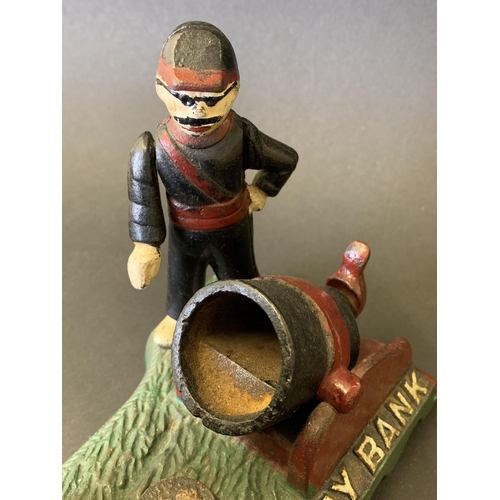 80 - A vintage cast iron and hand painted 'Artillery Bank' money box in working condition, 7 1/2