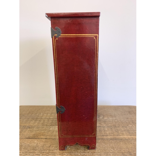 88 - A vintage Oriental style red painted jewellery cabinet with two drawers, stands 16