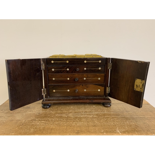 89 - An antique inlaid wooden jewellery casket, stands 12