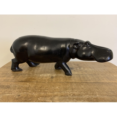 92 - A large and heavy antique carved ebony hippopotamus, approx. 18 3/4