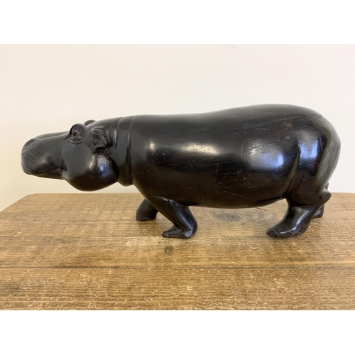 92 - A large and heavy antique carved ebony hippopotamus, approx. 18 3/4