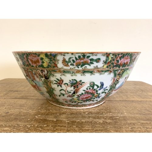 95 - A large antique Chinese canton famille rose punch bowl with all overhand painted decoration, 13