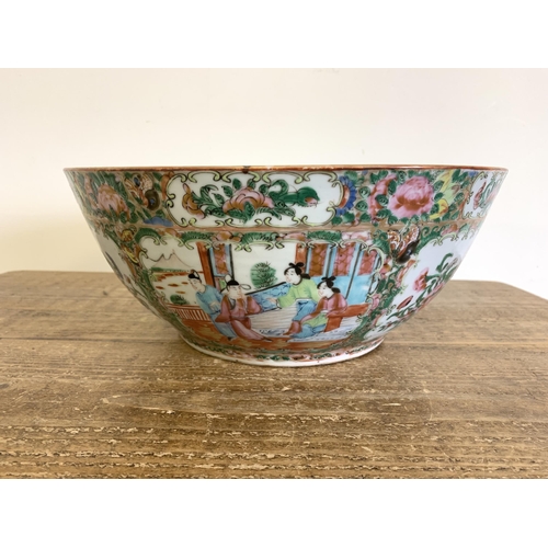 95 - A large antique Chinese canton famille rose punch bowl with all overhand painted decoration, 13