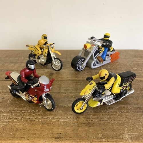 461 - A Hot Wheels motorcycle and rider together with Fisher Price and two other examples (mild playwear)