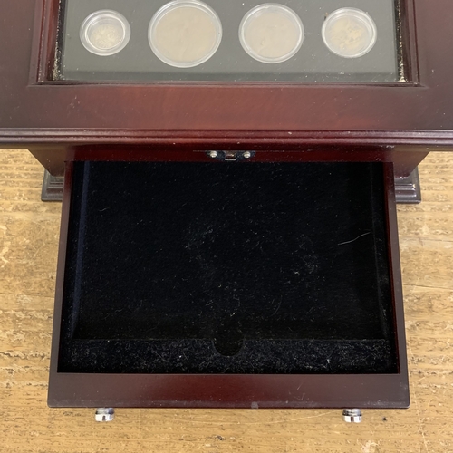 153 - Danbury Mint George V coins and stamp set housed in a wooden glazed case with drawer, silver weight ... 