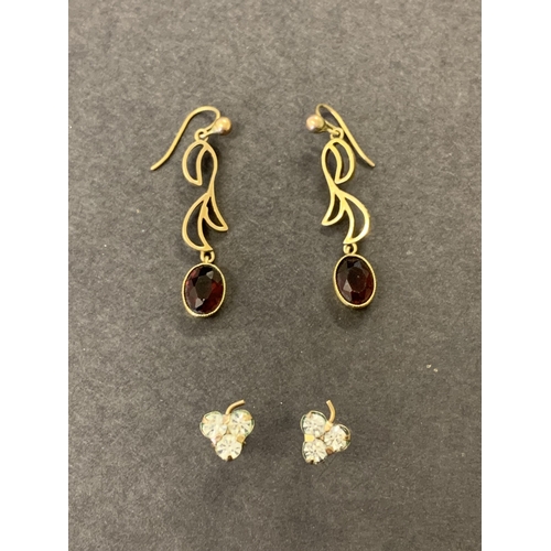 184 - Two pairs of 9ct gold earrings, one pair with red stones, the other with white (does not test as dia... 